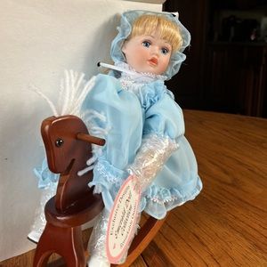 NWOT EMERALD DOLL COLLECTION APROX 8 INCH BLOND DOLL ON ROCKING HORSE